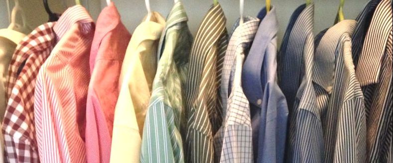 Shirts hanging neatly in rainbow order